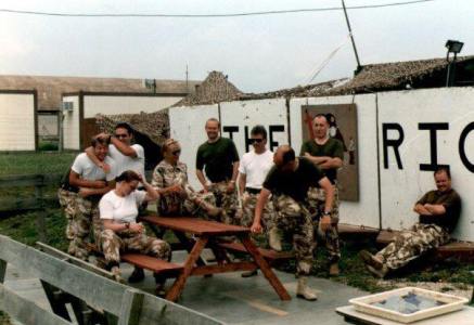 RIC Incurlik, Turkey featuring... Photogs: Sgt Gary Garbett Cpl Dave Smith ( now Abel) SAC Jamie Beck (having head rubbed by Dave Abel). Dave Able's future wife SAC Sarah Jones (now Abel) sitting on bench in front